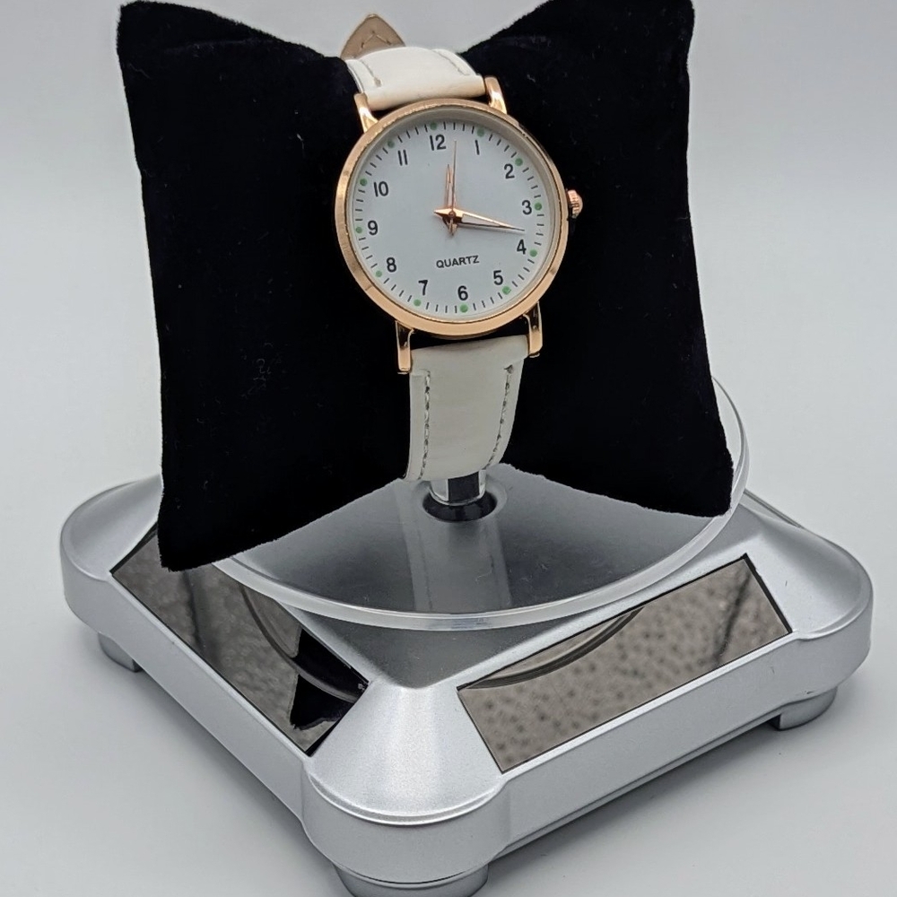 Rose Gold watch with Leather Strap and Analog Display